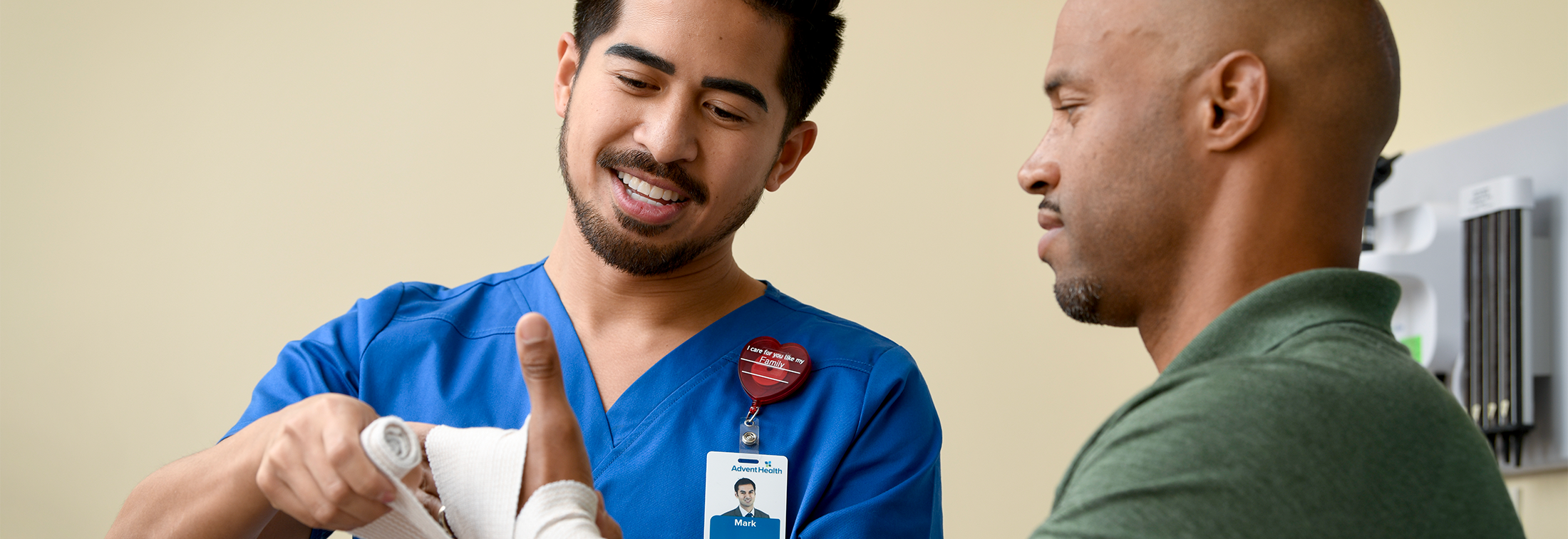 Three doctors having a discussion in a hospital hallway.